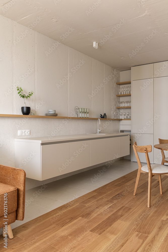Fototapeta premium modern beige kitchen interior with kitchen accessories, loft style kitchen interior