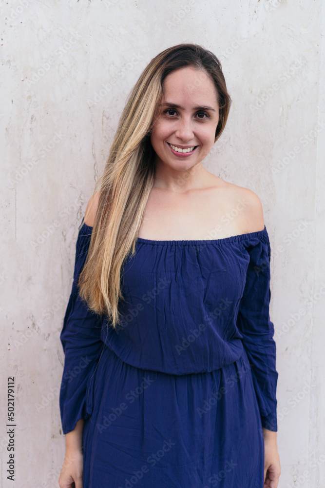 Portrait of a beautiful woman in casual clothing standing on the street Portrait of a beautiful woman in casual clothing standing on the street
