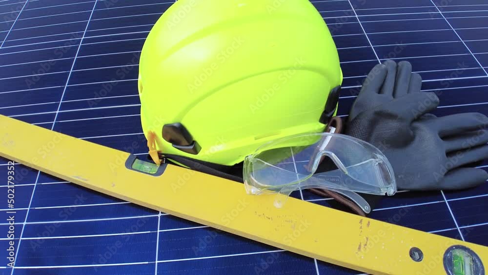 Engineers solar panel installation tools and gear, left on photovoltaic cell surface