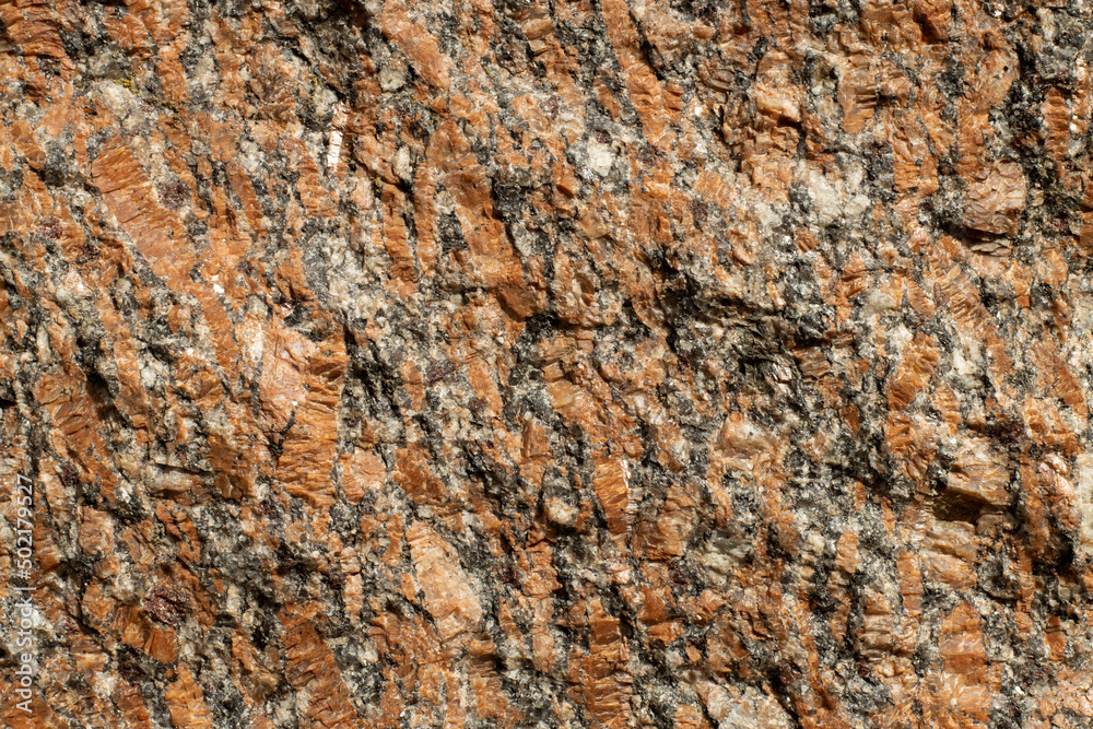 Granite surface texture in bright sunlight close up Granite surface texture in bright sunlight close up