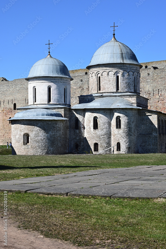 An ancient cathedral and church in the Ivangorod medieval fortress on the border of Russia and Estonia in the Leningrad region. Medieval architecture and historical heritage.       