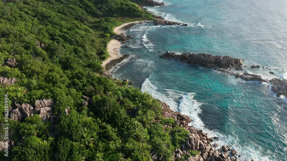 Aerial dolly over south coast La Digue with numerous capes and beaches Aerial dolly over south coast La Digue with numerous capes and beaches