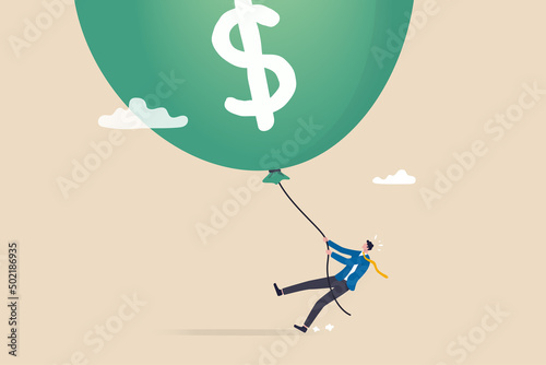 FED, Federal Reserve try to tame inflation down by interest rate hike, economic risk or investment bubble concept, businessman Federal Reserve or government try to pull big inflation balloon down. photo
