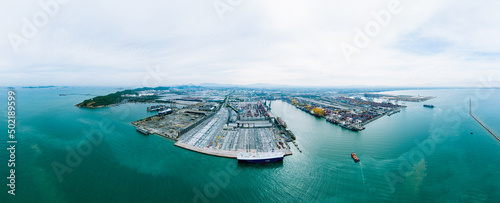 Aerial view container ship and ro-ro ship.Aerial view Evening time scene of Loading big vessel in the port of Laem Chabang terminal, Container Crane, Unloading Containers, 