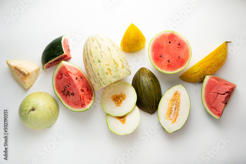 Top view set of  whole half melon and watermelons slice summer concept light surface