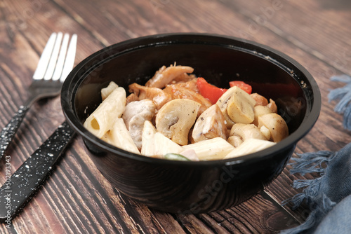  homemade cooked chicken mushroom pasta in a bowl 