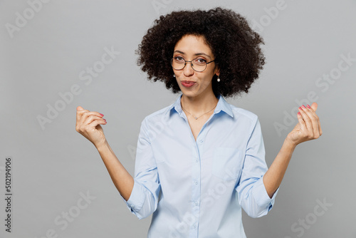 Fotobehang Young employee business corporate lawyer woman of African American ethnicity in classic formal shirt work in office rubbing fingers showing cash gesture asking for money isolated on grey background