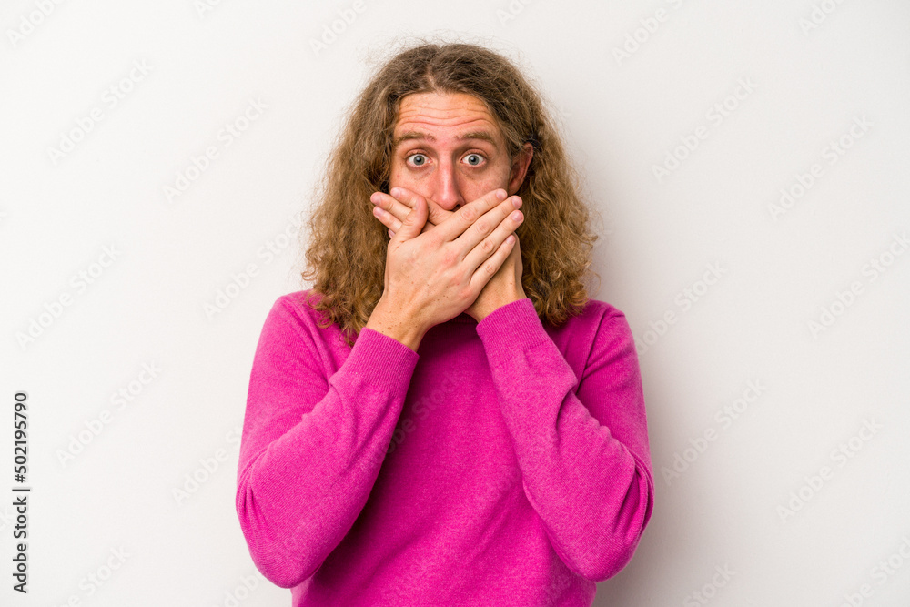 Young caucasian man isolated on white background covering mouth with hands looking worried. Young caucasian man isolated on white background covering mouth with hands looking worried.