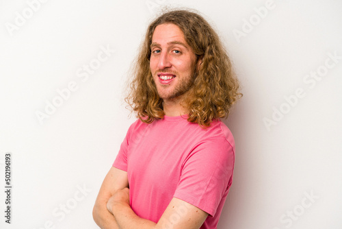 Young caucasian man isolated on white background confident keeping hands on hips.