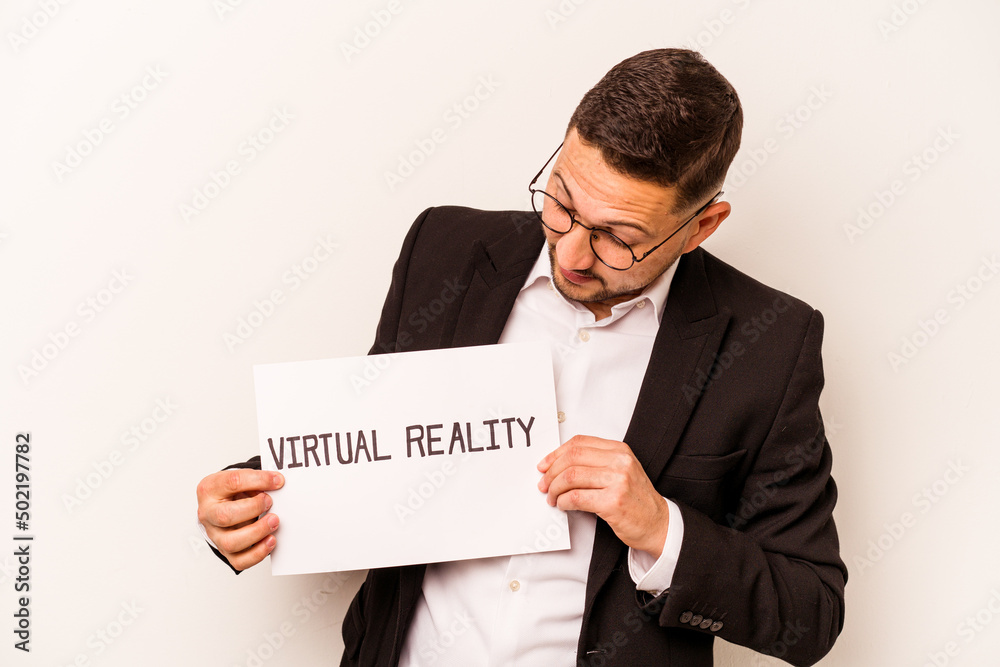 Hispanic business man holding a virtual reality placard isolated on white background Hispanic business man holding a virtual reality placard isolated on white background