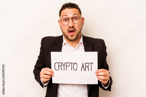 Hispanic business man holding a crypto art placard isolated on white background