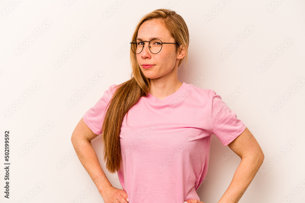 Young caucasian woman isolated on white background frowning face in displeasure, keeps arms folded. Young caucasian woman isolated on white background frowning face in displeasure, keeps arms folded.