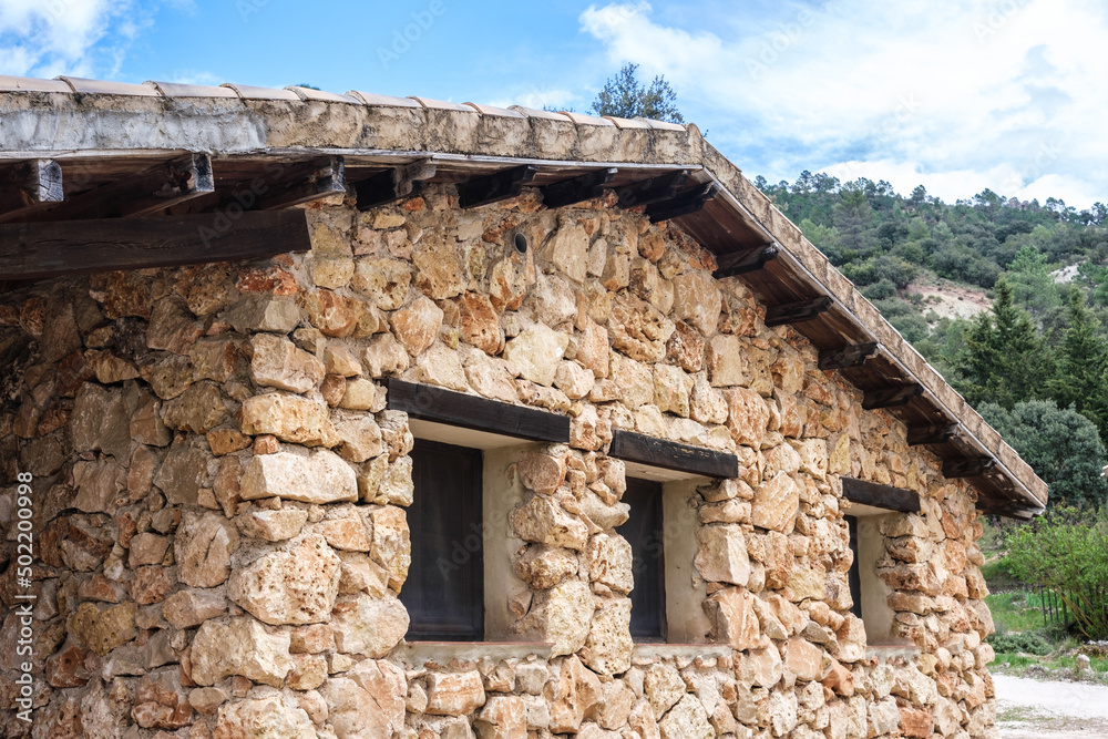 Heavy stone hut on a sunny mountain day. Heavy stone hut on a sunny mountain day.