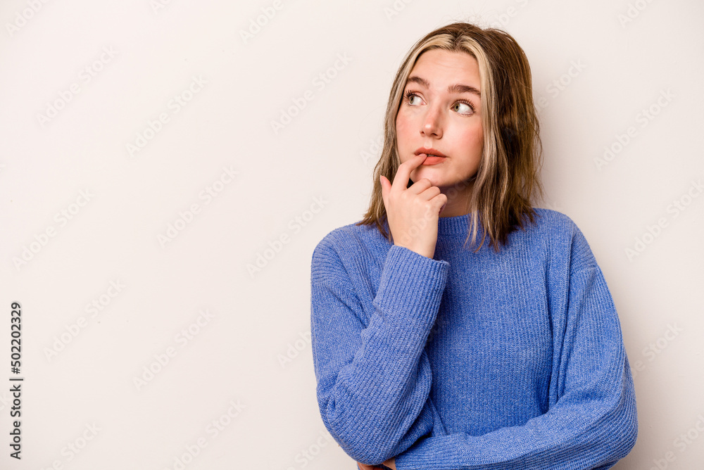 Young caucasian woman isolated on white background looking sideways with doubtful and skeptical expression. Young caucasian woman isolated on white background looking sideways with doubtful and skeptical expression.
