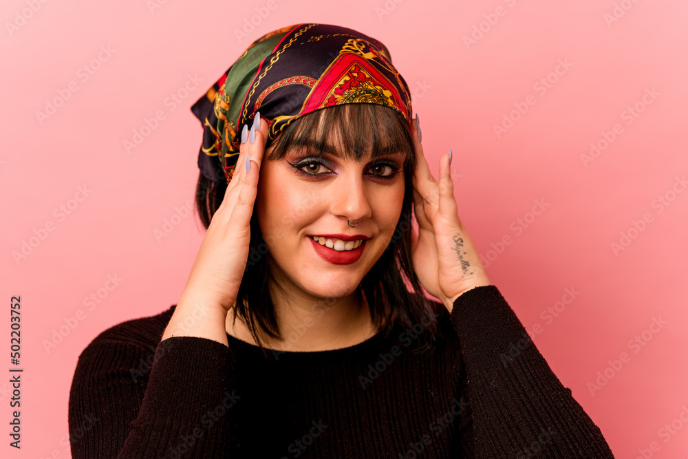 Young caucasian makeup artist woman isolated on pink background Young caucasian makeup artist woman isolated on pink background