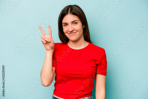 Young caucasian woman isolated on blue background showing number two with fingers.
