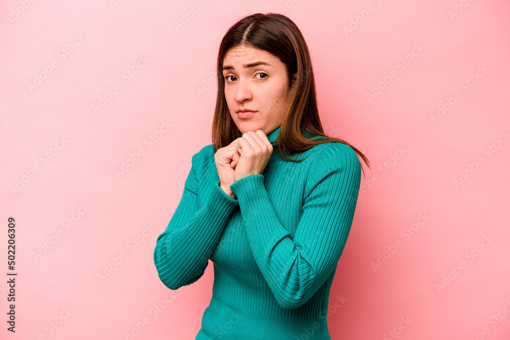 Young caucasian woman isolated on pink background scared and afraid. Young caucasian woman isolated on pink background scared and afraid.