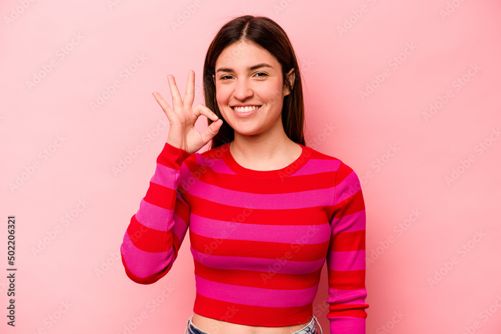 Young caucasian woman isolated on pink background cheerful and confident showing ok gesture. Young caucasian woman isolated on pink background cheerful and confident showing ok gesture.