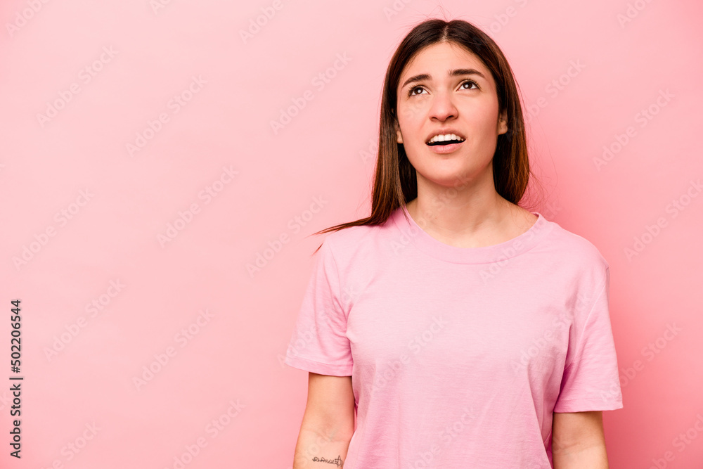 Young caucasian woman isolated on pink background shouting very angry, rage concept, frustrated. Young caucasian woman isolated on pink background shouting very angry, rage concept, frustrated.