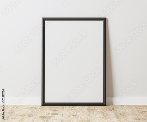 Blank Vertical black frame on wooden floor with white wall  3 4 ratio  30x40 cm  18x24 inches  poster frame mock up  3d rendering