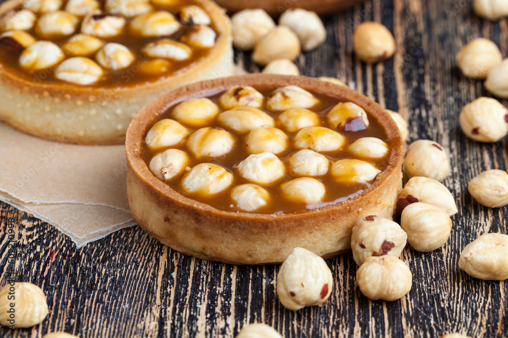 delicious tartlet cake with soft caramel and roasted hazelnut