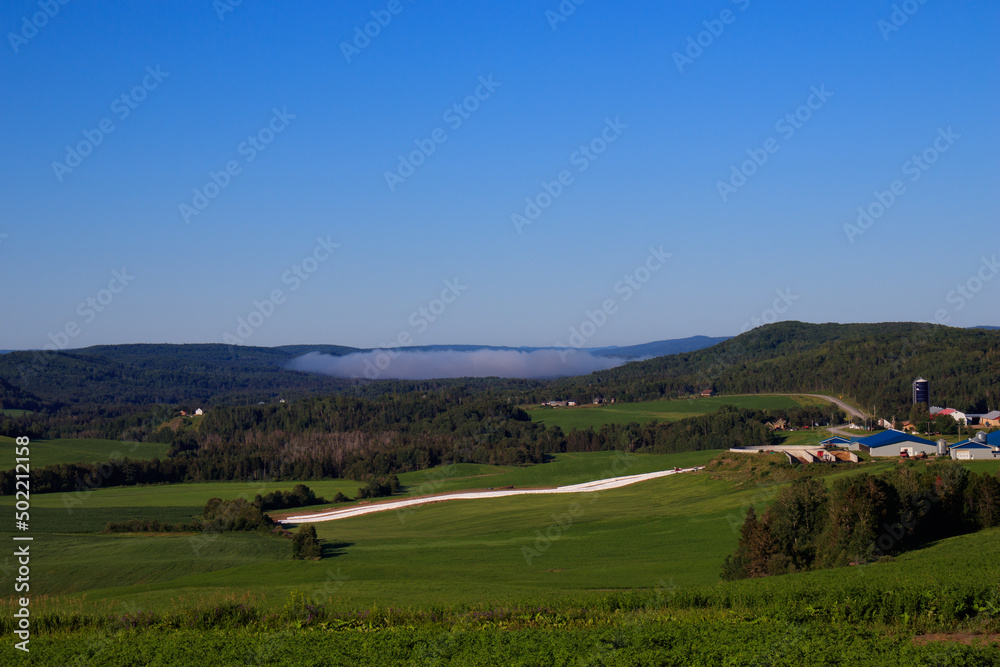 village in the mountains with fog