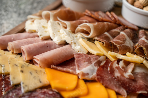 Close-up of cold cuts and cheeses. High angle.
