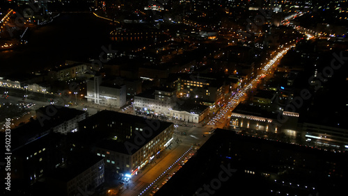 Light trails on the modern building. The life of the city at night with traffic. Concept of night life © Media Whale Stock