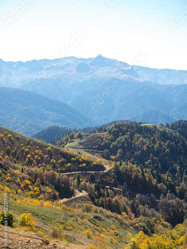 Mountain trails. beautiful panorama of mountains, aerial perspective, distant peaks in a blue haze, freedom and beauty of nature. Autumn view of the Caucasus mountains in Russia