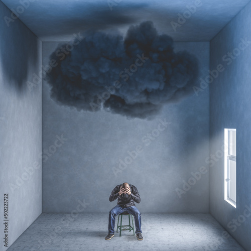 Fototapet desperate man in a room with big black cloud