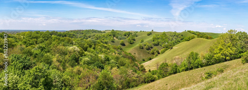 Beautiful panorama of green hills and blue sky in spring or summer season - Zagajicka brda