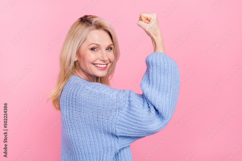 Obraz premium Profile photo of senior funny blond lady hand fist wear blue pullover isolated on pink color background