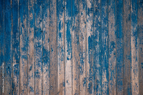 Brown natural wood dark background, vintage, with knots and nail holes, wood planks, old painted blue
