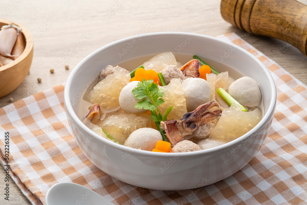 Thai Clear Soup with minced pork ,fish meatballs ,sheet of dried pig skin ,carrot and dried squid Thai Clear Soup with minced pork ,fish meatballs ,sheet of dried pig skin ,carrot and dried squid