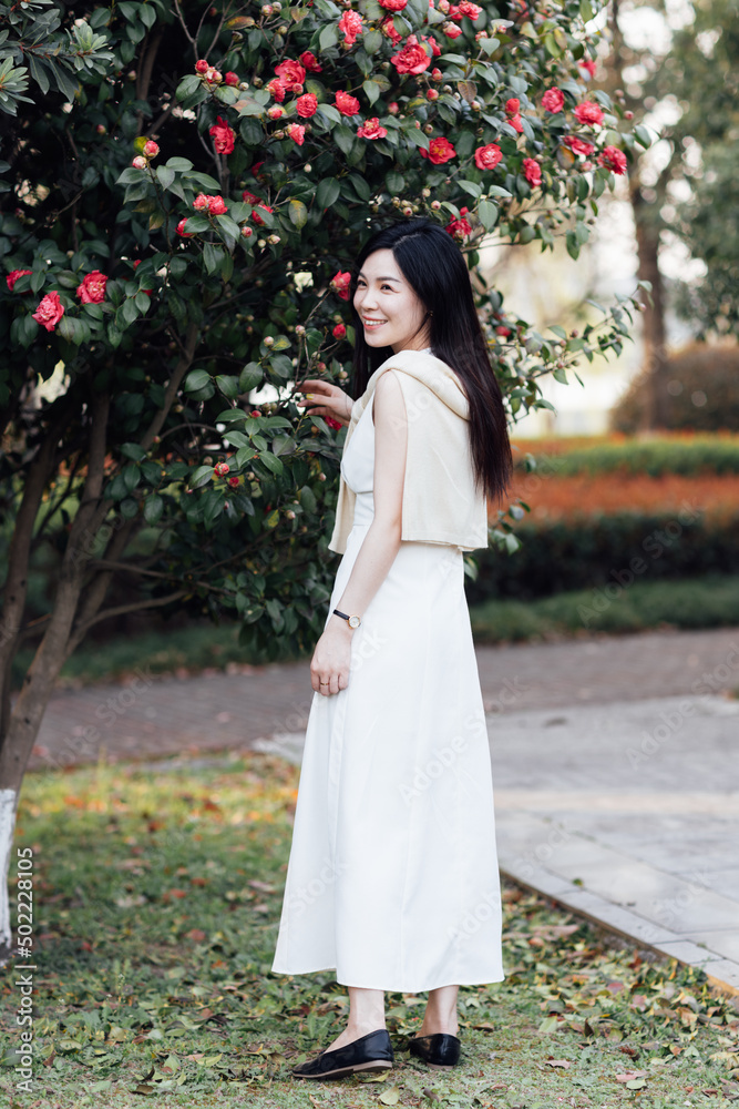 Candid lifestyle Portrait of happy young beautiful asian sexy woman enjoying life outdoor in park at spring. Smiling millennial girl with perfect clear glow skin and long brunette hair Candid lifestyle Portrait of happy young beautiful asian sexy woman enjoying life outdoor in park at spring. Smiling millennial girl with perfect clear glow skin and long brunette hair