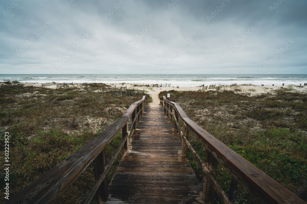 Overcast moody cloudy day on the beach boardwalk Amelia Island, Florida
