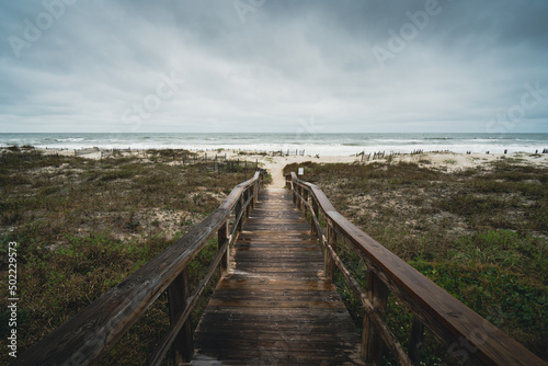 Overcast moody cloudy day on the beach boardwalk Amelia Island, Florida