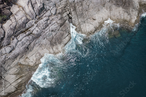 waves crashing on rocks on a coastline