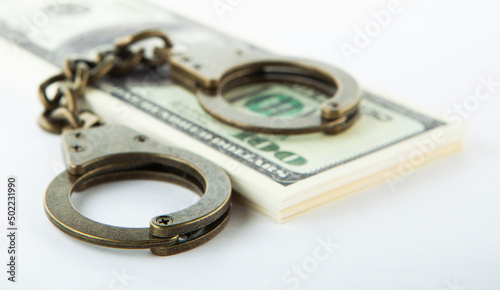 image of handcuffs money white background 