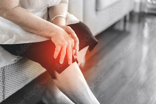 Asian eldetly woman has knee osteoarthritis pain photo