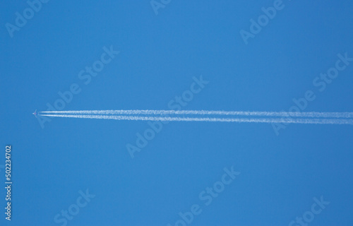 An Aircraft High in a Blue Sky
