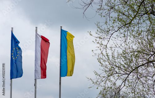 View entree flag Ukrainian, Polish, Union of Europe at spring.
