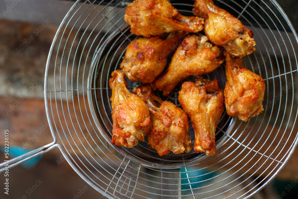 Fototapeta premium Fried chicken in deep fry outdoor