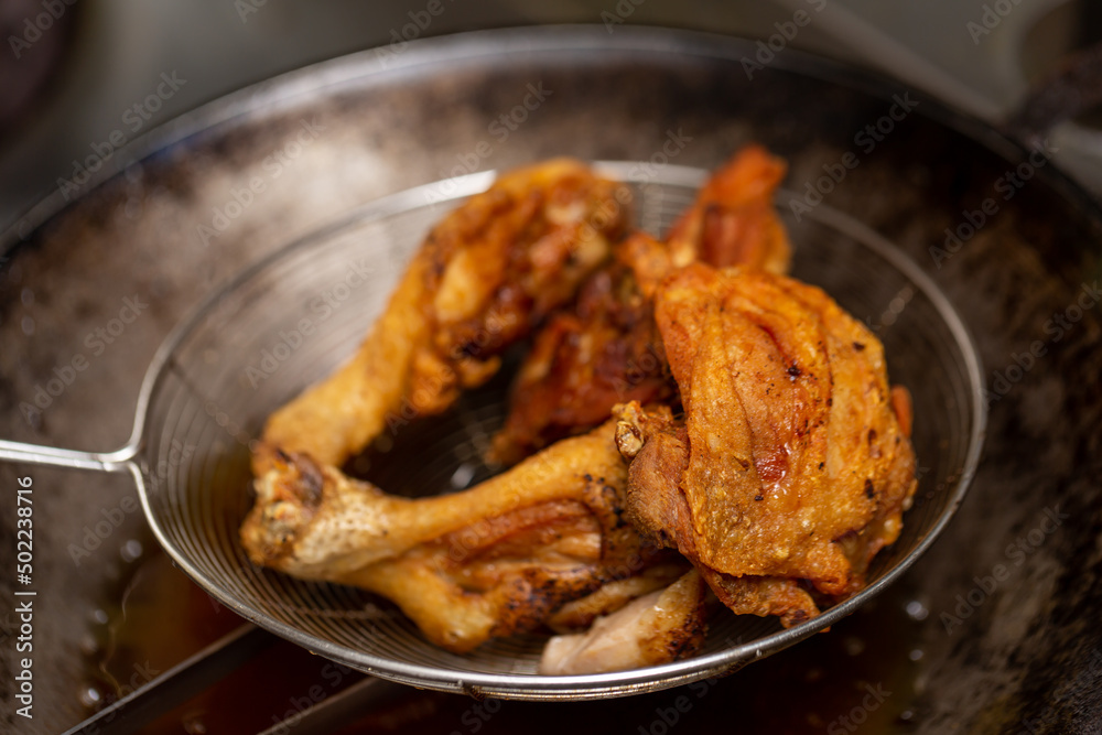 Fried chicken in hot oil and boiling in pan Fried chicken in hot oil and boiling in pan