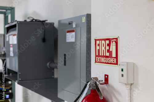 Fire extinguisher system on the wall background, powerful emergency equipment for industrial.