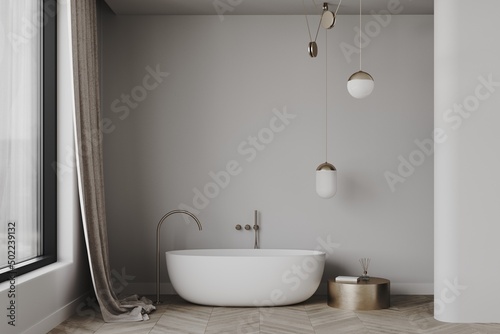 3d render of a minimalistic bathroom with with free standing bath  golden tap  gold round coffee table  decoration