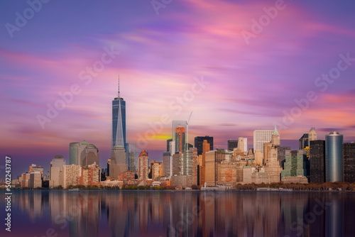 New York City Manhattan downtown skyline at dusk with skyscrapers over Hudson River, USA