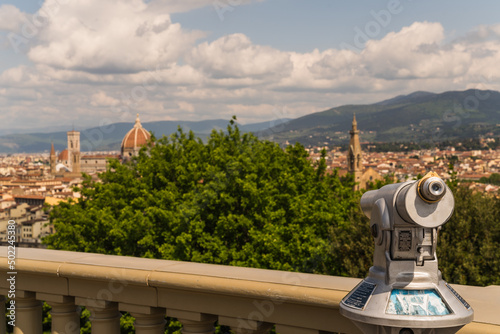 Telescope for viewing city of florence with city and cathedral on the background © gammaphotostudio