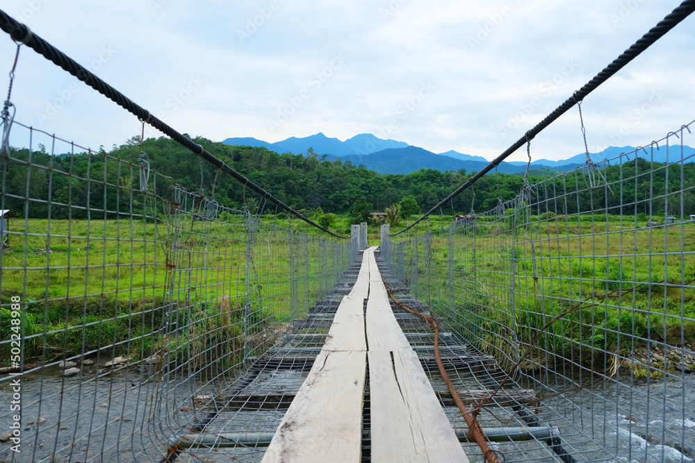 Tegudon Tourism Village is an accommodation, park, campsite in Kota Belud, Sabah, Malaysia. Hanging suspension bridge in the park with overlooking the mount Kinabalu. Tegudon Tourism Village is an accommodation, park, campsite in Kota Belud, Sabah, Malaysia. Hanging suspension bridge in the park with overlooking the mount Kinabalu.