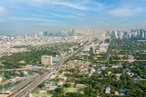 Metro Manila, Philippines - The SLEX Skyway going towards the Metro Manila cityscape and skyline. photo